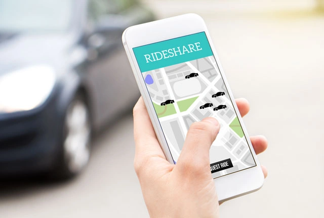 Rideshare app interface displaying cars on map